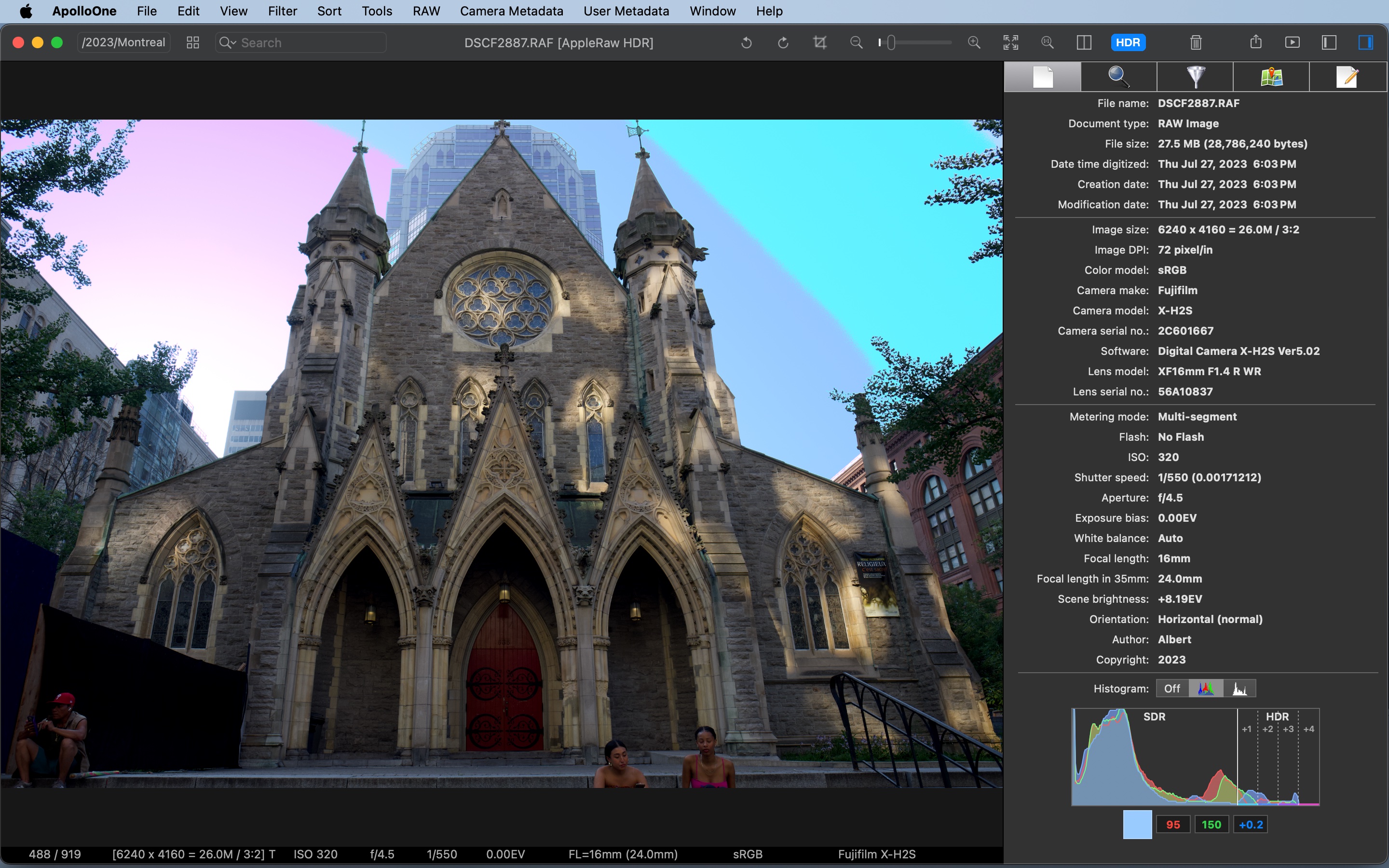 ApolloOne HDR Visualizer showing cyan, blue, purple, and magenta false-color bands on the sky above a cathedral
